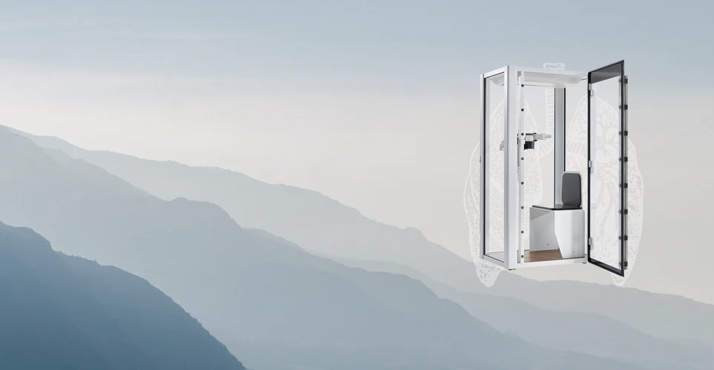 Bodyplethysmograph Vyntus BODY mit gezeichneter Lunge vor einer Berglandschaft